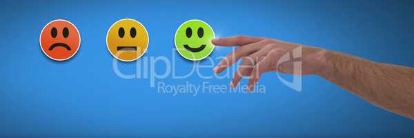 Hand pointing at feedback smiley faces satisfaction