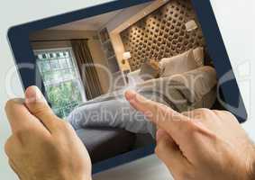 Hand touching tablet with accomodation hotel bedroom