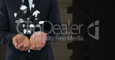 Mixed various app icons connected and Businessman with hands palm open and dark background