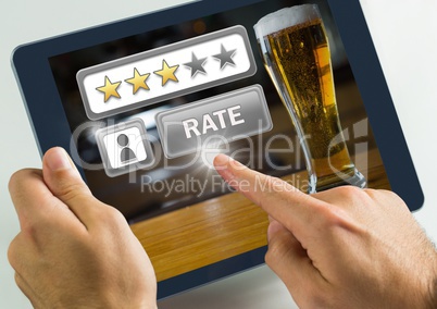 Hand touching tablet with Rate button and review stars in bar