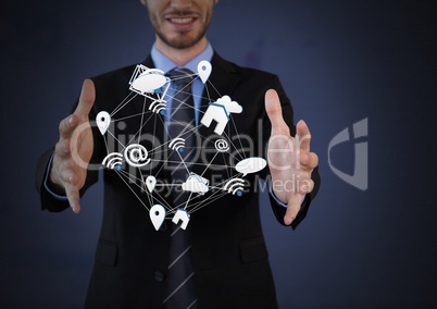 Mixed various app icons connected and Businessman with hands palm open and dark background