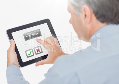 Hand holding tablet with feedback satisfaction buttons