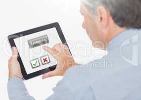 Hand holding tablet with feedback satisfaction buttons