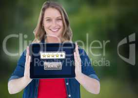 Woman holding tablet with star ratings button