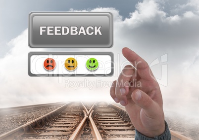 Hand pointing at feedback button and smiley faces review on train track