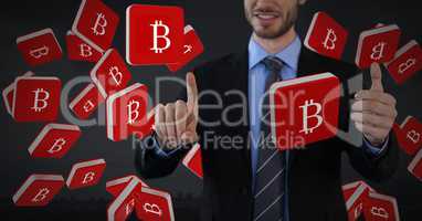 Bitcoin icons and Businessman touching air with dark background