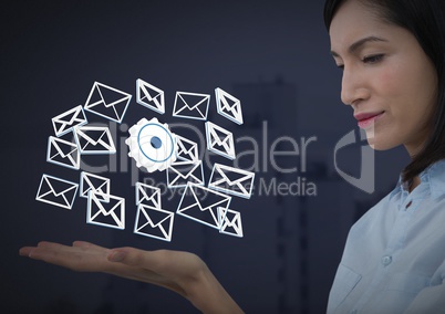 Email message cog app icons and Businesswoman with hands palm open and dark background