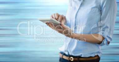 Hand holding tablet  with motion blur background
