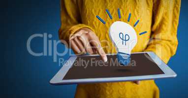 Hand holding tablet with 3D light bulb idea icon