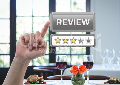 Hand touching review button and star ratings in restaurant