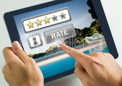 Hand touching tablet with Rate button and review stars in swimming pool