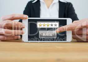 Woman holding tablet with rate button and star review ratings