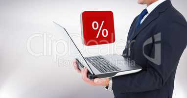 Hand holding laptop with percent symbol icons