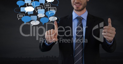 Chat bubble app icons and Businessman touching air with dark background