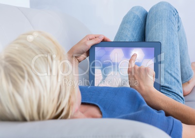 Woman using tablet with perspective shapes