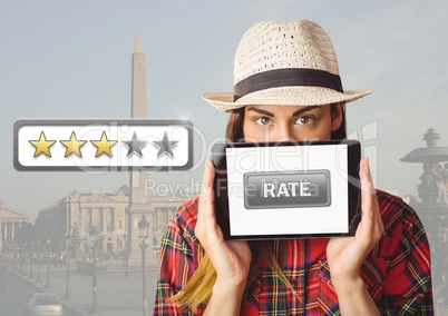 Woman holding tablet with rate button and star reviews over travel destination