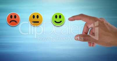 Hand pointing at smiley faces feedback satisfaction icons