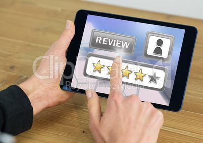 Hands holding tablet with review star ratings