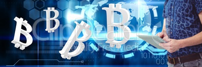 Hands holding tablet with bitcoin symbol icons