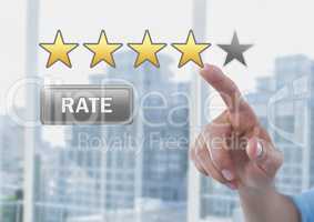 Hand pointing at Rate button and star reviews in city office
