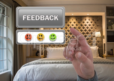 Hand pointing at feedback button and smiley faces review in accommodation bedroom