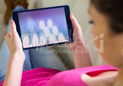 Woman using tablet with perspective shapes