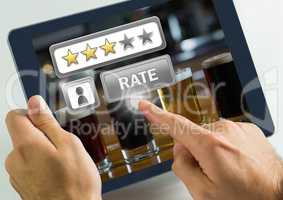 Hand touching tablet with Rate button and review stars in bar