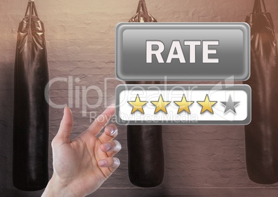 Hand touching Rate button and review stars in boxing gym