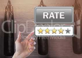 Hand touching Rate button and review stars in boxing gym