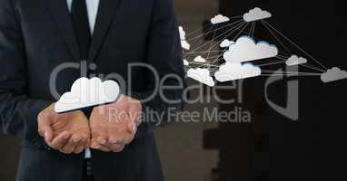 Cloud icons and Businessman with hands palm open and dark background
