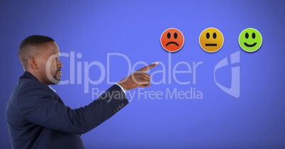 Man pointing at smiley faces feedback satisfaction icons