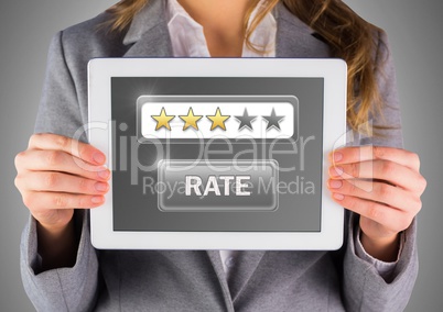 Hands holding tablet with review star ratings