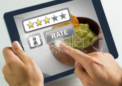 Hand touching tablet with Rate button and review stars in with guacamole