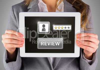 Woman holding tablet with review button and star ratings
