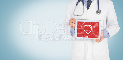 Composite image of doctor showing digital tablet on white background