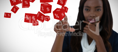 Composite image of businesswoman with hand on chin using interface screen