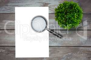 Magnifying glass on paper