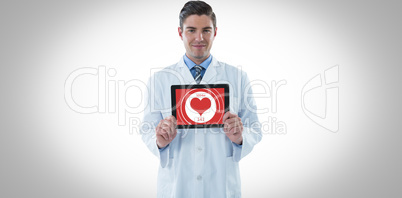 Composite image of doctor showing digital tablet