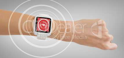 Composite image of cropped image of woman hand wearing smart watch