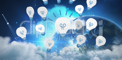 Composite image of glowing light bulb icon