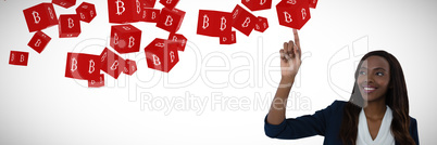 Composite image of businesswoman touching interface screen