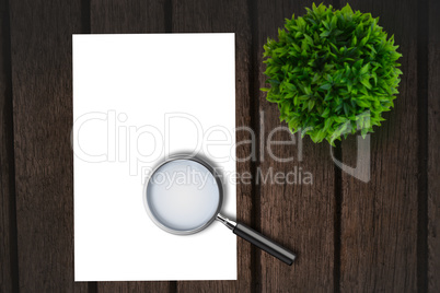 Magnifying glass on paper