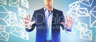 Composite image of businessman touching the invisible screen