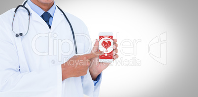 Composite image of midsection of male doctor pointing on mobile phone