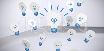 Composite image of glowing light bulb icon