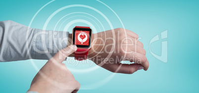 Composite image of cropped image of man using smart watch