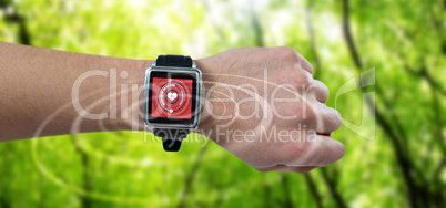 Composite image of cropped image of man wearing watch