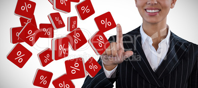 Composite image of portrait of smiling businesswoman in suit touching invisible interface