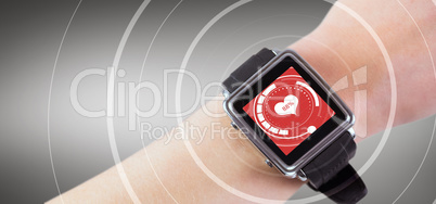 Composite image of woman using smartwatch