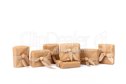 Gift box for Christmas wrapped in brown recycled paper